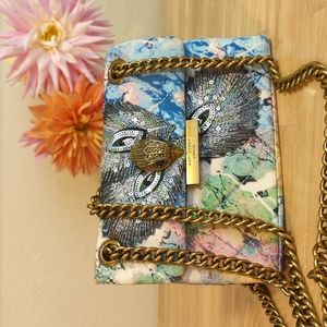 Mini Kurt Geiger peacock print purse.